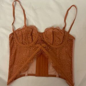 Urban Outfitters out from under corset top